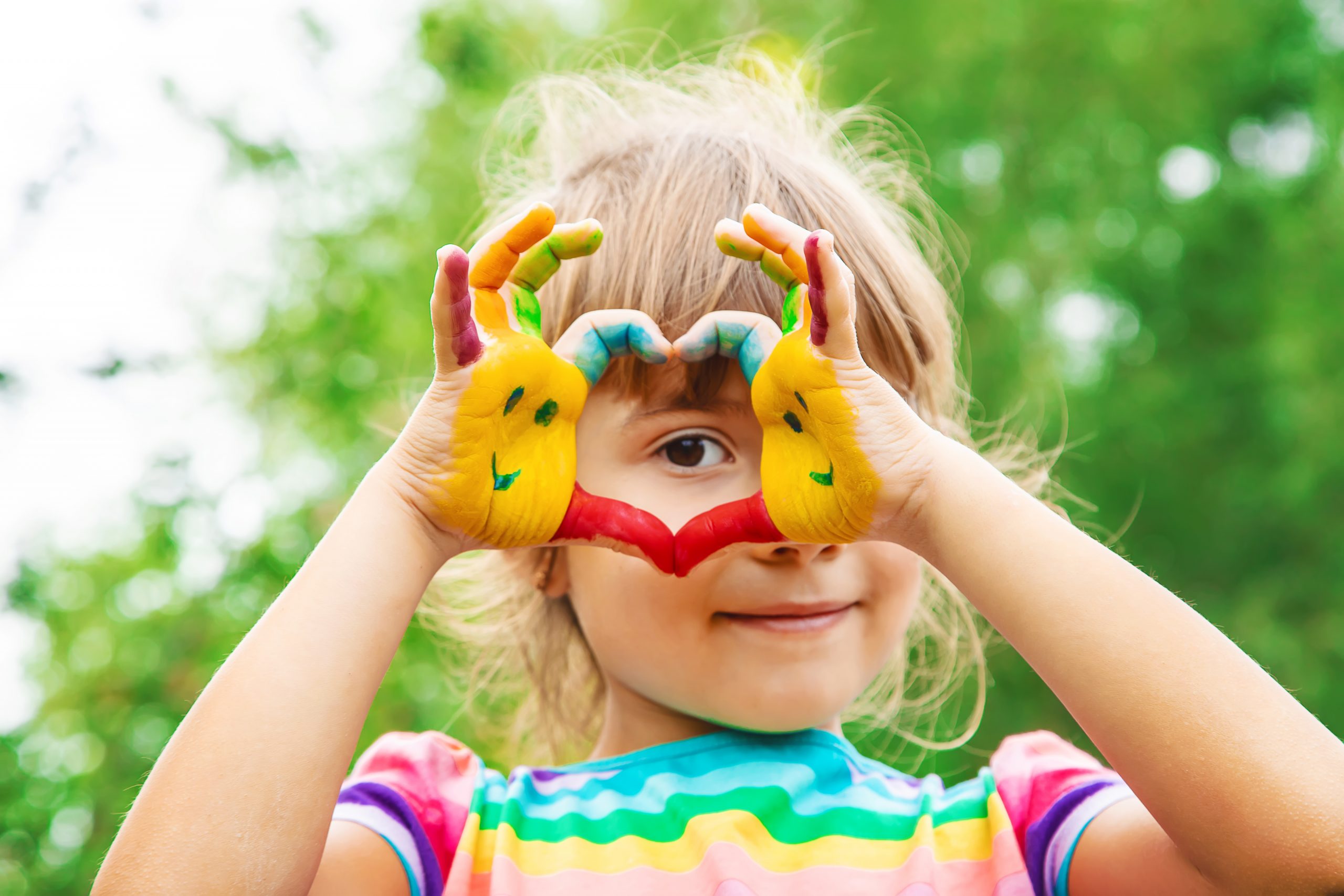 children hands in colors. Summer photo. Selective focus. nature